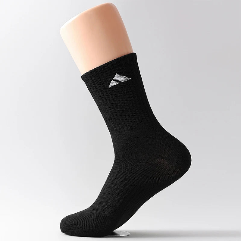5 Pairs of Black and White Patterned Mid Length Socks Suitable for Both Men and Women Comfortable and Unisex Sports Socks