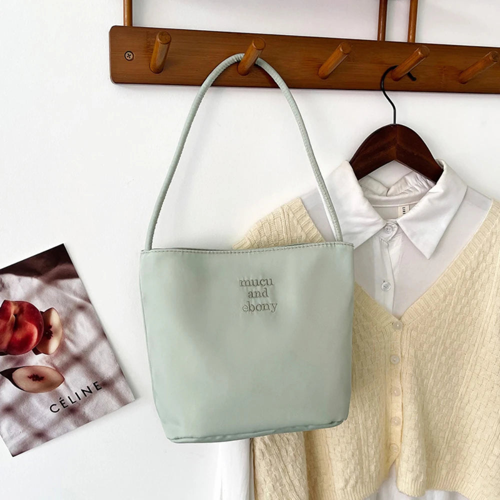 Summer new simple nylon underarm bag Korean niche design alphabet embroidery portable commuter bucket bag